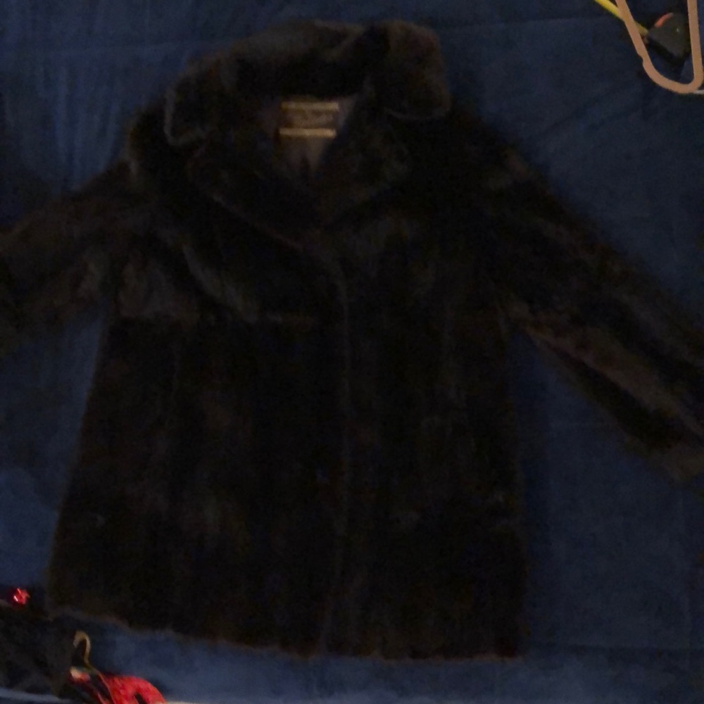 Mink coat. Scalloped at the bottom.